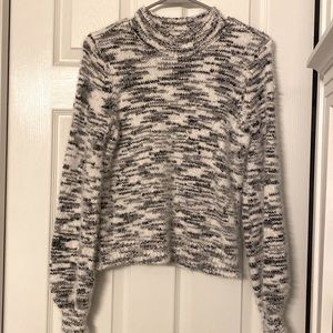 Medium black and white sweater.